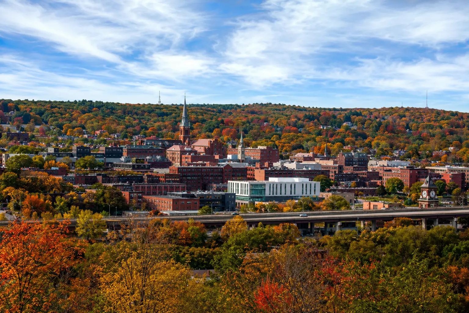 Autumn Cityscape With Vibrant Foliage Over Fitchburg
